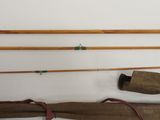 two different types of fishing rods and a bag