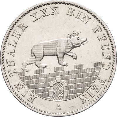 une image représentant une pièce d'argent sur laquelle figure un rhinocéros couché sur le dos