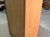 a wooden cabinet that is sitting on the floor