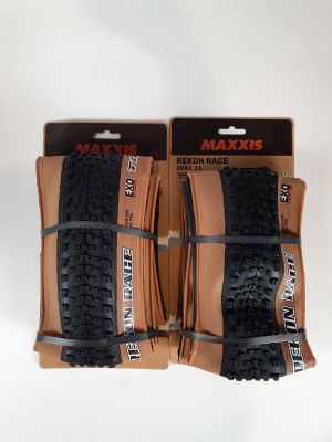 two black and brown bicycle tires are on display in front of a white background