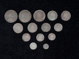 some silver coins are arranged in the shape of a heart