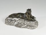 bronze statue of a tiger on a rock with the word arr on it