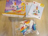 a box of legos sitting on a table next to a box of legos
