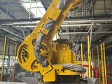a large yellow robot that is in a building