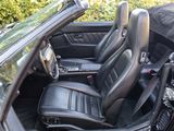 a picture of a black convertible car with the top down