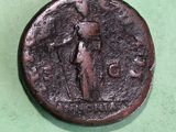 a close up of a coin on a green surface