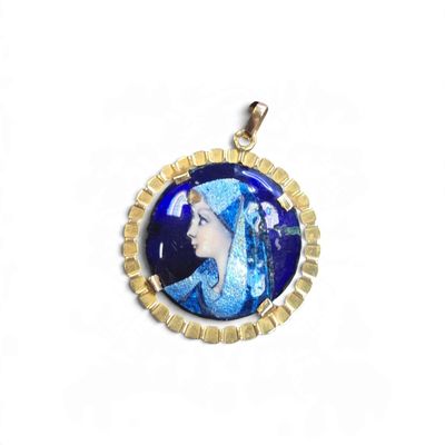 an image of a picture of a woman in a blue dress on a gold plated pendant