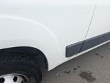 a picture of a white truck parked in a parking lot