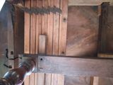 a pipe that is connected to a wooden structure