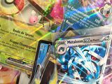 a lot of pokemon cards that are on the table