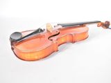 a violin that is sitting on a white surface