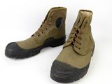pair of brown boots with black soles on a white background