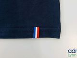 the back of a t - shirt with a red, white, and blue stripe on it