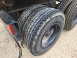 a truck that has a tire on the back of it