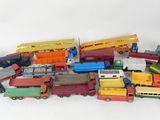 a lot of toy trains on a white surface