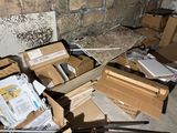 a pile of boxes and papers sitting on the floor