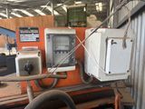 an image of a machine in a factory with a box on the back of it
