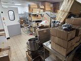 many boxes stacked on top of each other in a room