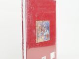 the book is red and has a picture of a woman on it