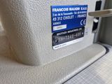 a close up of a sewing machine with a label on it