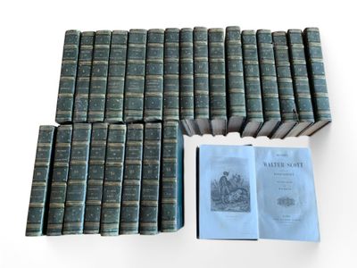 several books are stacked on top of each other on a table