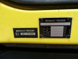 a close up of a yellow truck with a sticker on it