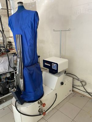 a mannequin on a stand with a blue cover over it