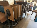 a lot of chairs and tables in a restaurant