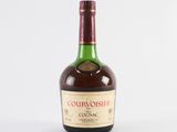 a close up of a bottle of liquor on a white surface