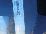 a picture of a bus window with a ticket in it