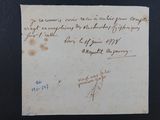 un vieux morceau de papier avec une écriture dessus, posé sur une table