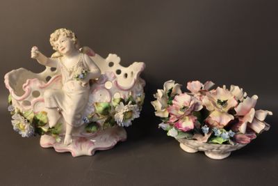 two figurines that are sitting next to each other