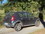a black car parked on the side of the road