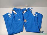 a close up of a pair of blue pants with a badge on the side