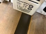 an image of a close up of a power strip connected to a computer