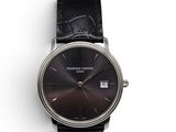 an image of a close up of a wrist watch on a white surface