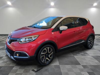 a red and black car is parked on a checkered floor