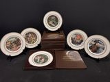 six assiettes sur lesquelles figurent les portraits d'un homme et d'une femme