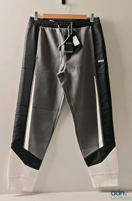the black and white pants are hanging on a hanger