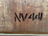 a close up of a piece of wood with writing on it