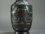a vase that has been decorated with colorful designs on it