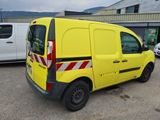 a yellow van that is parked in a parking lot