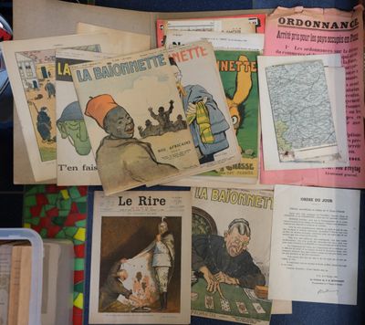 a lot of old french magazines on the table