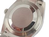 a watch that is sitting on a white surface