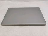 an image of a laptop computer sitting on top of a white sheet