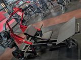 an image of a gym room with a bench and weights