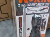 two screwdrivers in the package on the floor