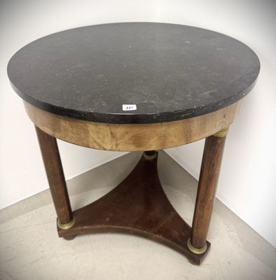 a small table with a black marble top on it