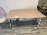 a small table with two chairs in front of it