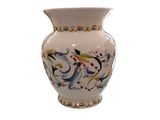 a white vase with a floral design on it